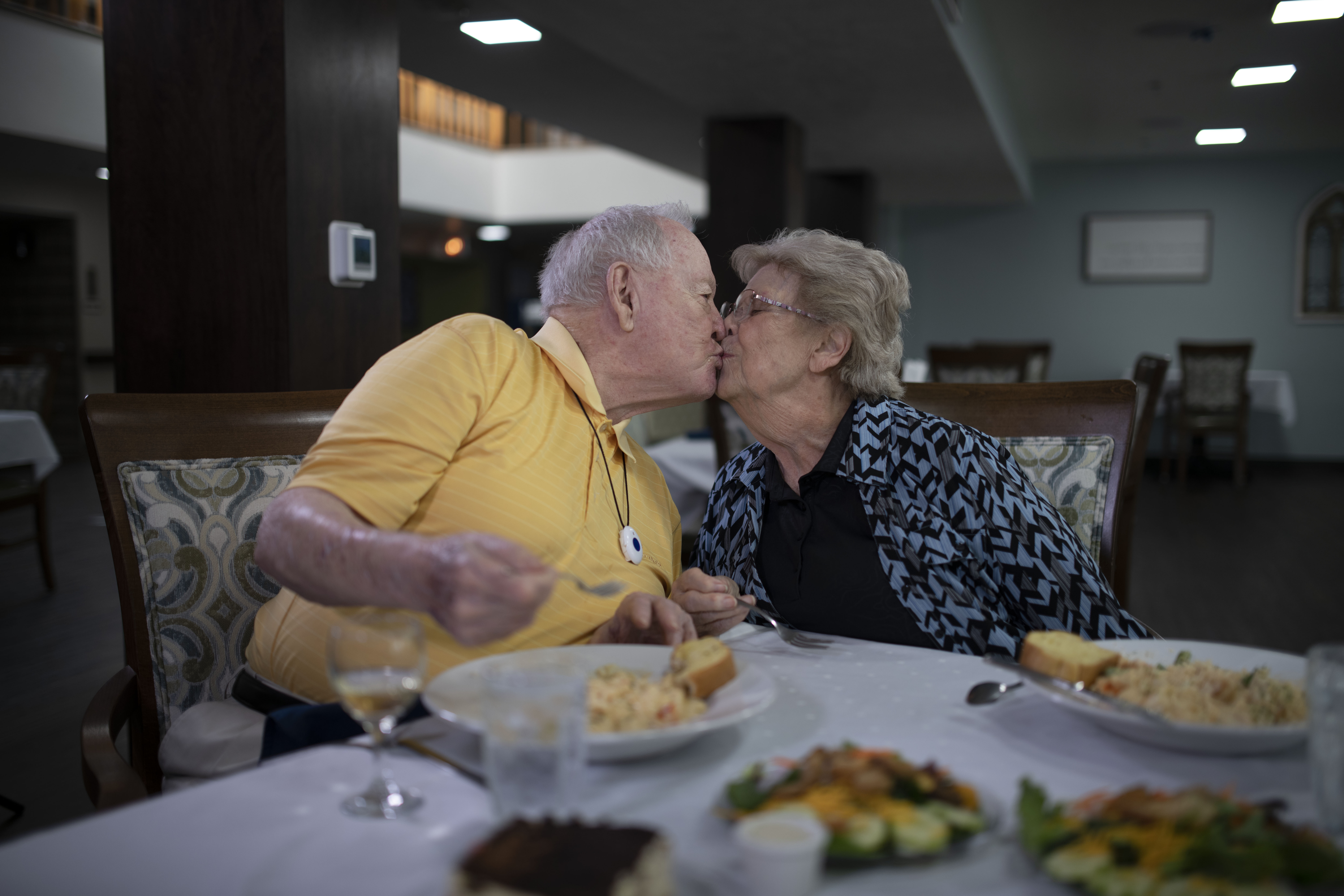 A shared mealtime kiss by our lovely married residents.
